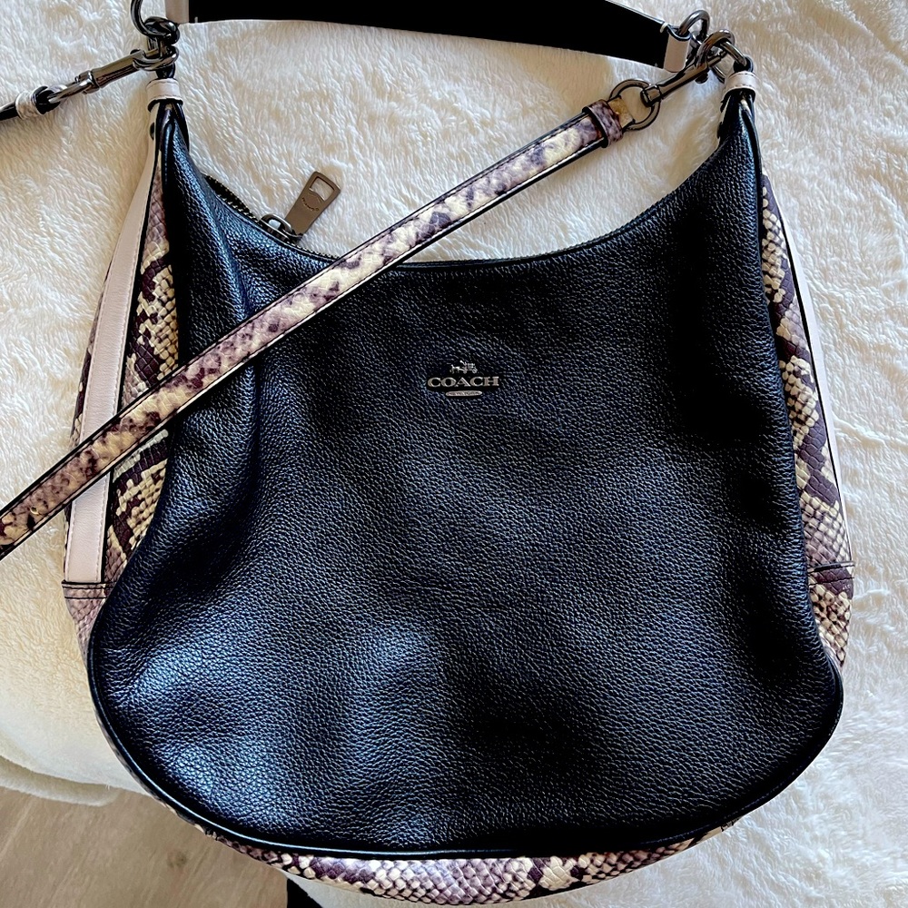 COACH #F57503
Leather / snake-embossed trim.
14 1/4" (L) x 10" (H) x 4 1/2" (W)